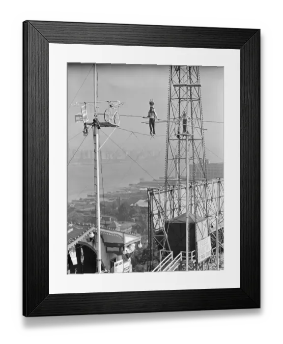 Framed Print : Man and Woman Holding Pole on Highwire Framed Print : Man and Woman Holding Pole on Highwire