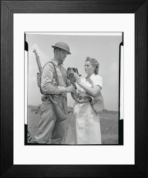 Framed Print : Soldier Explaining Gas Mask to Female Army Nurse Framed Print : Soldier Explaining Gas Mask to Female Army Nurse