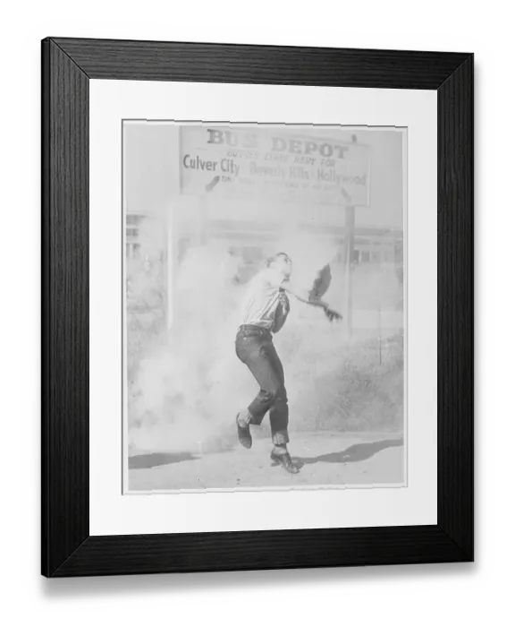 Framed Print : Man Throwing Tear Gas Bomb At Police