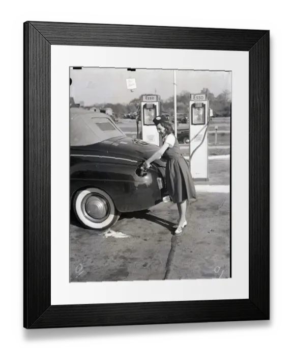 Framed Print : Woman In Dress Dispenses Gas Framed Print : Woman In Dress Dispenses Gas