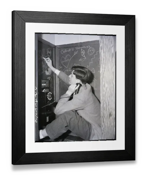 Framed Print : Boy in Telephone Booth Doodling on Blackboard Framed Print : Boy in Telephone Booth Doodling on Blackboard
