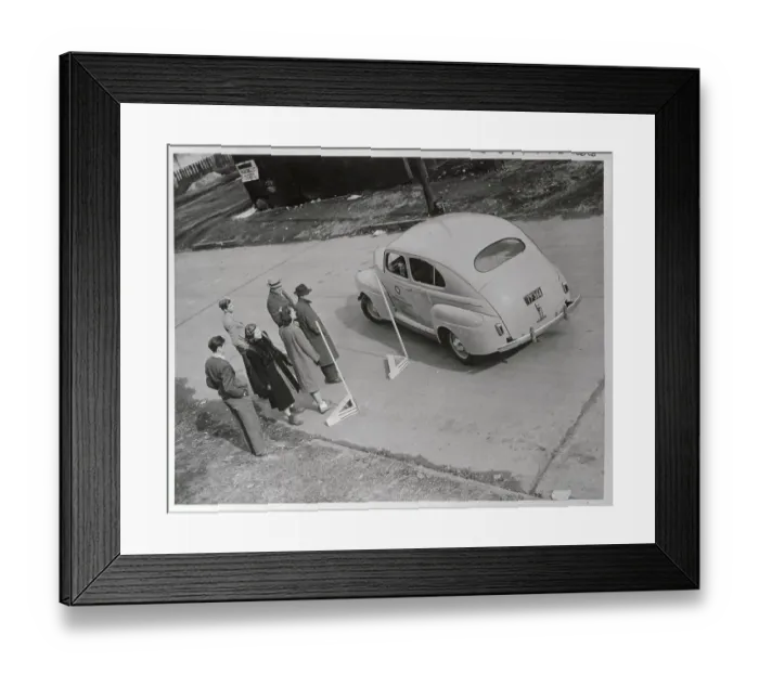 Framed Print : People Watching Student Driver Parking