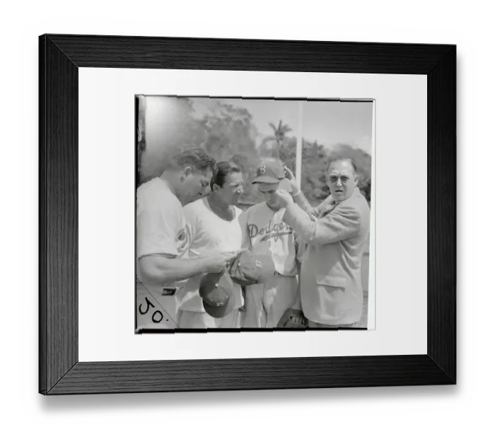 Framed Print : Larry McPhail Placing Protective Inserts in Player's Hat Framed Print : Larry McPhail Placing Protective Inserts in Player's Hat