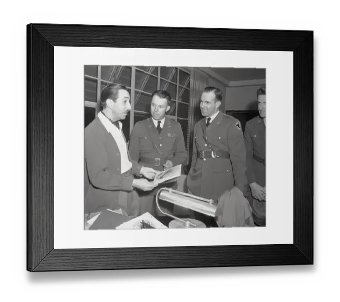 Framed Print : Walt Disney Discussing Insignia with Air Corps Officer Framed Print : Walt Disney Discussing Insignia with Air Corps Officer