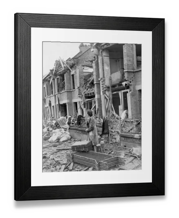 Framed Print : Woman Surveys Damage to Houses Framed Print : Woman Surveys Damage to Houses