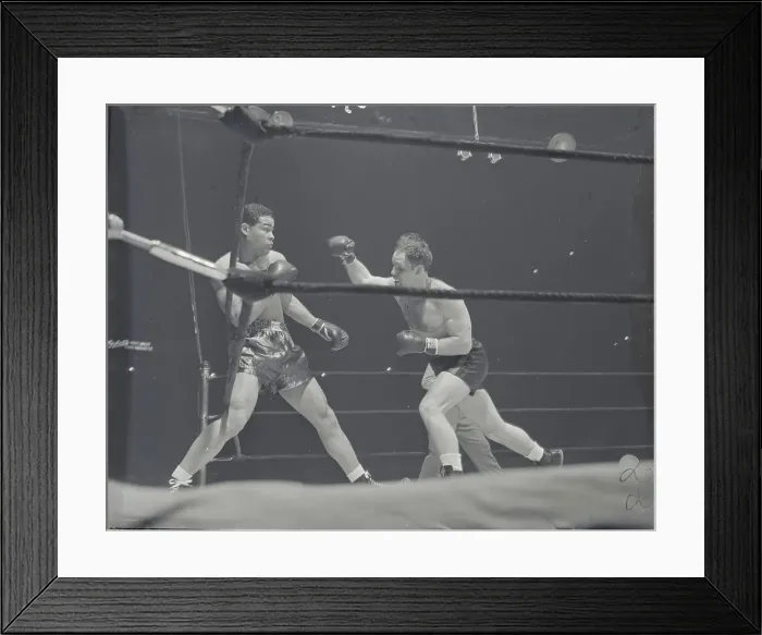 Framed Print : Clarence Burman Attacking Joe Louis Framed Print : Clarence Burman Attacking Joe Louis