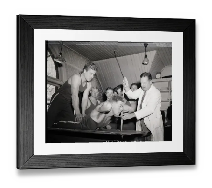 Framed Print : Doctor Tests Flexibility Of Student Framed Print : Doctor Tests Flexibility Of Student