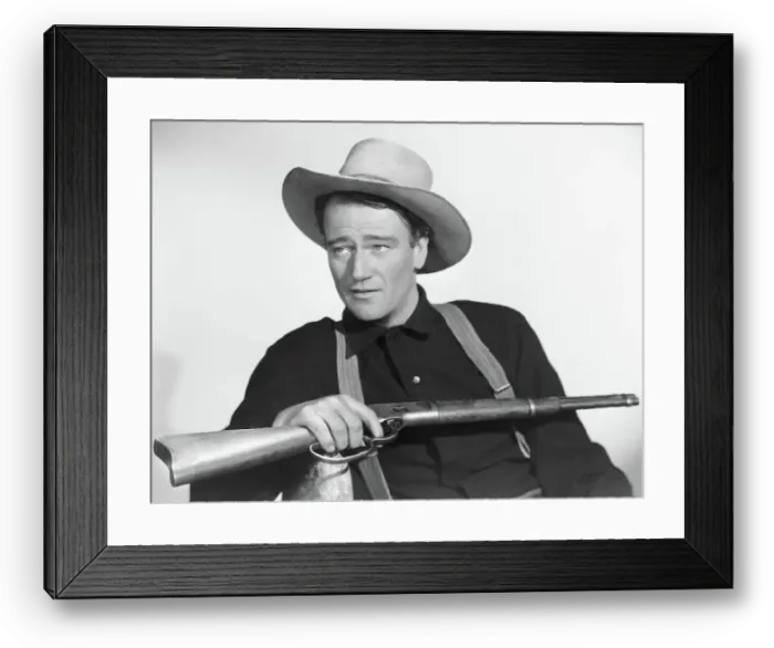 Framed Print : John Wayne Seated With Rifle