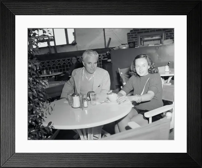 Framed Print : Charlie Chaplin with Paulette Goddard Framed Print : Charlie Chaplin with Paulette Goddard