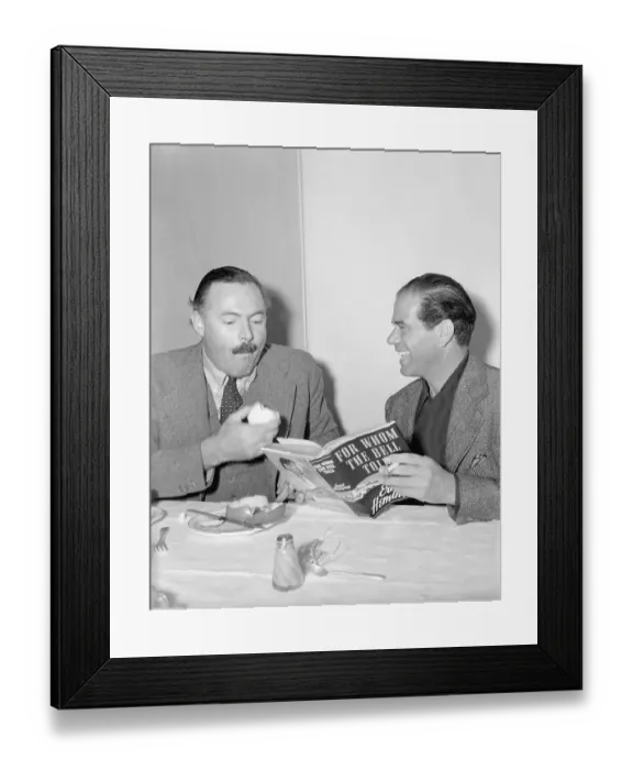 Framed Print : Ernest Hemingway Sitting With Frank Capra Holding Fruit Framed Print : Ernest Hemingway Sitting With Frank Capra Holding Fruit