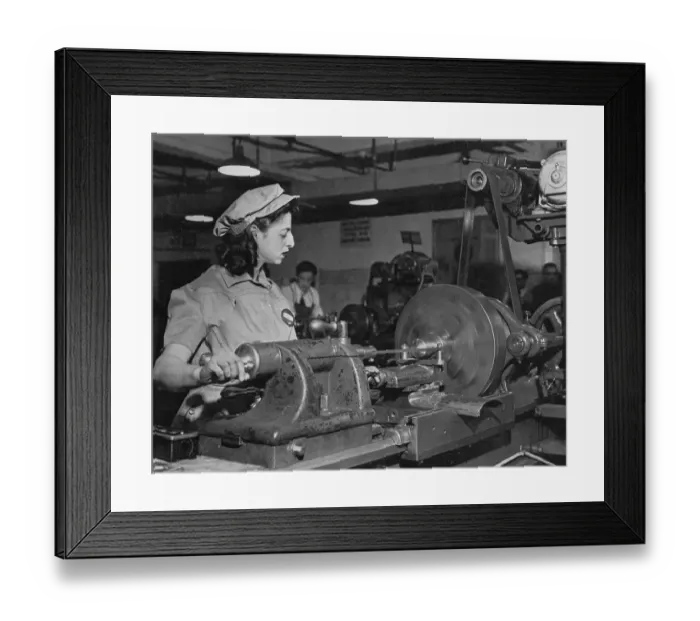 Framed Print : Young Woman Working on Machinery Framed Print : Young Woman Working on Machinery