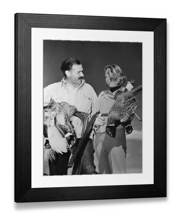 Framed Print : Ernest Hemingway and Martha Gellhorn Holding Birds Framed Print : Ernest Hemingway and Martha Gellhorn Holding Birds