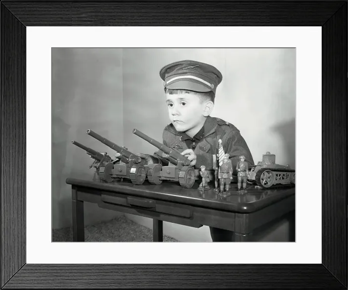Framed Print : Boy (6-7) with Military Toys