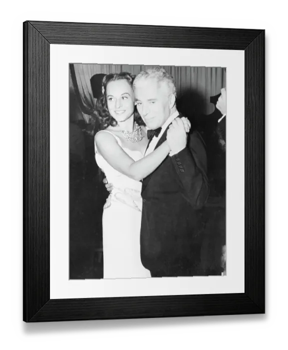 Framed Print : Charlie Chaplin Dancing with His Wife Framed Print : Charlie Chaplin Dancing with His Wife