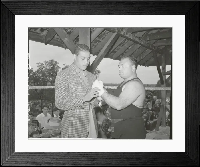 Framed Print : Joe Louis Observing Hand of Tony Galento Framed Print : Joe Louis Observing Hand of Tony Galento
