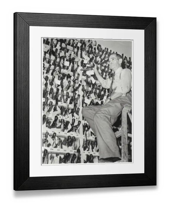 Framed Print : Officer Posing with Confiscated Guns Framed Print : Officer Posing with Confiscated Guns