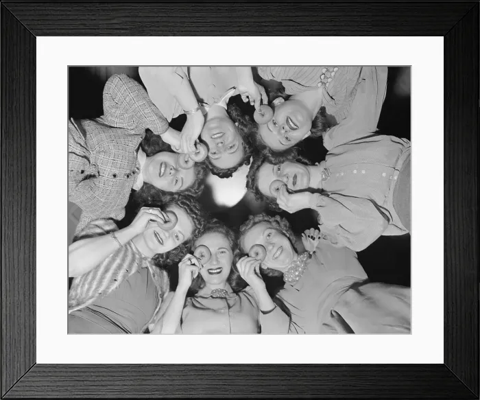 Framed Print : Women standing in circle and posing with doughnuts, view from below. Manhattan, New York City, New York State, USA. April 29, 1940 Framed Print : Women standing in circle and posing with doughnuts, view from below. Manhattan, New York City, New York State, USA. April 29, 1940