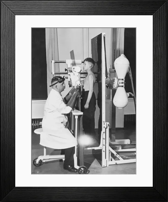 Framed Print : Doctor Taking X-Ray of Boy Framed Print : Doctor Taking X-Ray of Boy