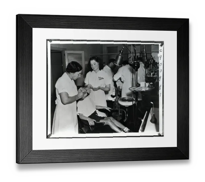 Framed Print : Dental Workers Work on Patients Framed Print : Dental Workers Work on Patients