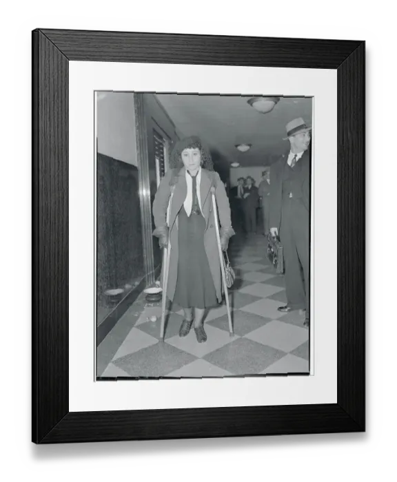 Framed Print : Injured Woman on Crutches