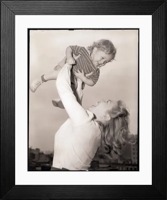 Framed Print : Mother Swinging Daughter Up in the Air