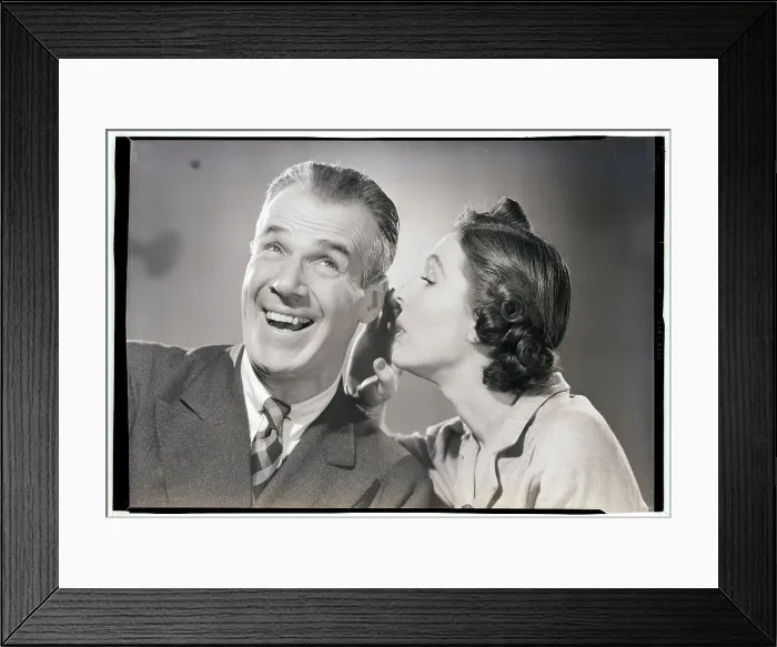 Framed Print : Woman Whispering in Man's Ear Framed Print : Woman Whispering in Man's Ear