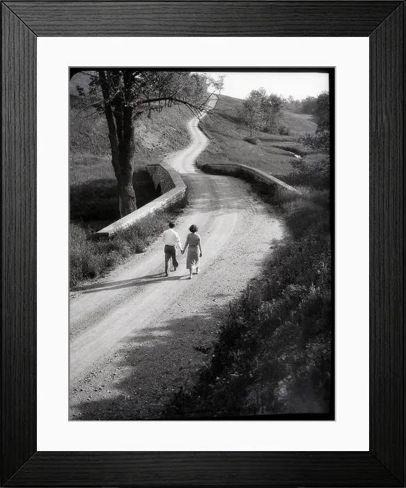 Framed Print : Couple Walking Along Rural Road Framed Print : Couple Walking Along Rural Road