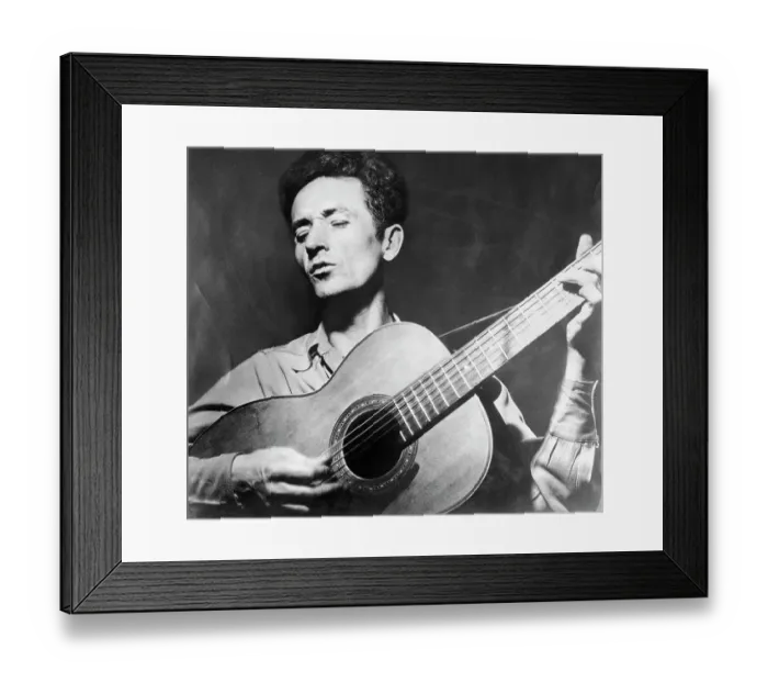 Framed Print : Woody Guthrie Playing the Guitar Framed Print : Woody Guthrie Playing the Guitar
