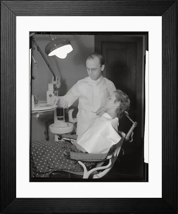 Framed Print : Dentist Preparing to Treat Female Patient Framed Print : Dentist Preparing to Treat Female Patient