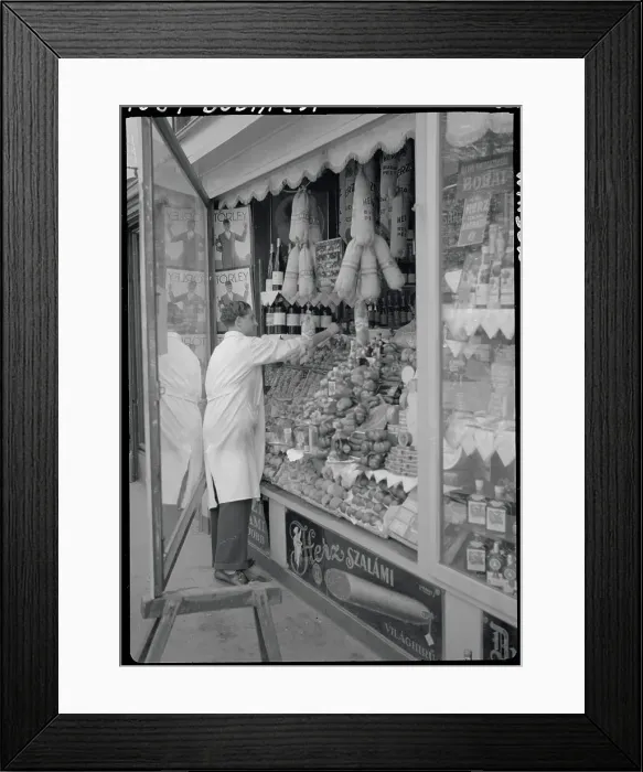 Framed Print : Meat Market Vendor Arranging Window Display Framed Print : Meat Market Vendor Arranging Window Display