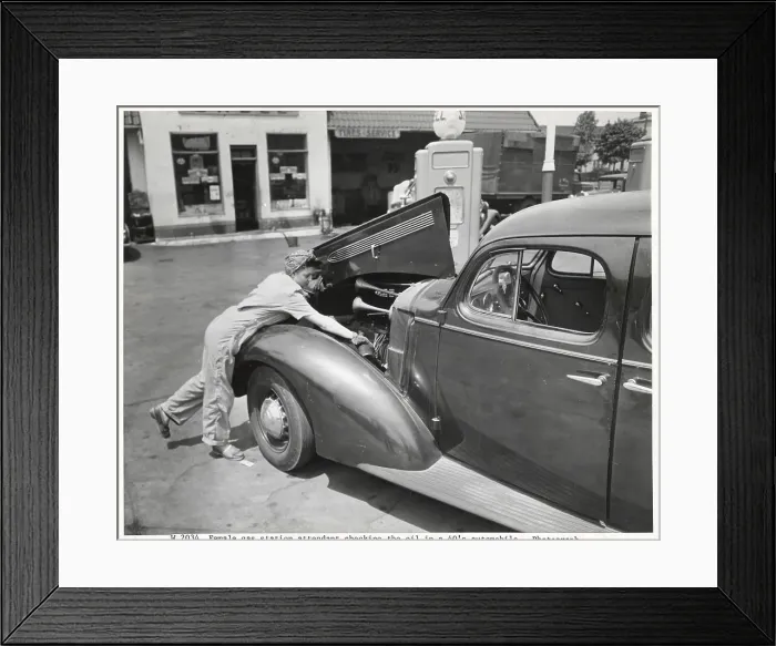 Framed Print : Female Gas Station Attendant Checking Oil Framed Print : Female Gas Station Attendant Checking Oil
