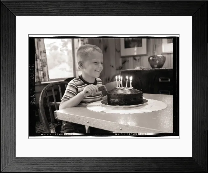 Framed Print : Boy Cutting Birthday Cake Framed Print : Boy Cutting Birthday Cake
