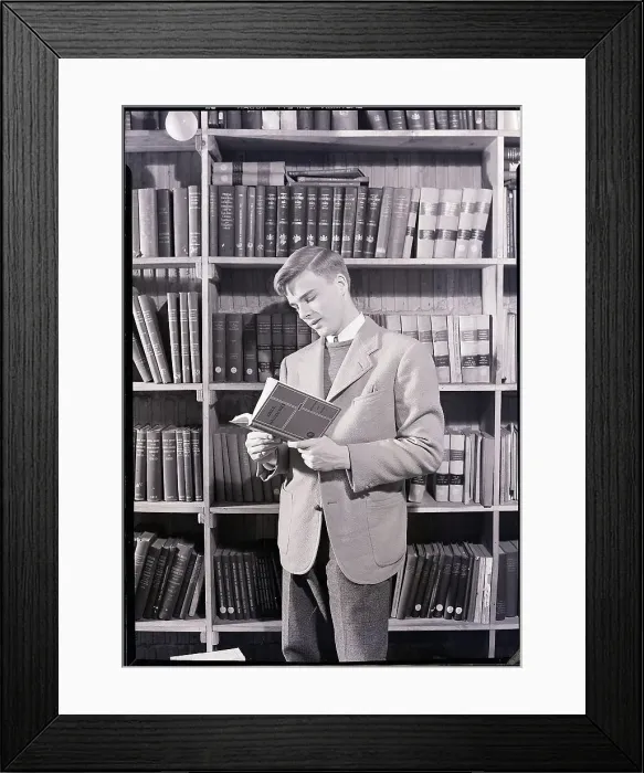 Framed Print : Boy in Library Reading Book Framed Print : Boy in Library Reading Book
