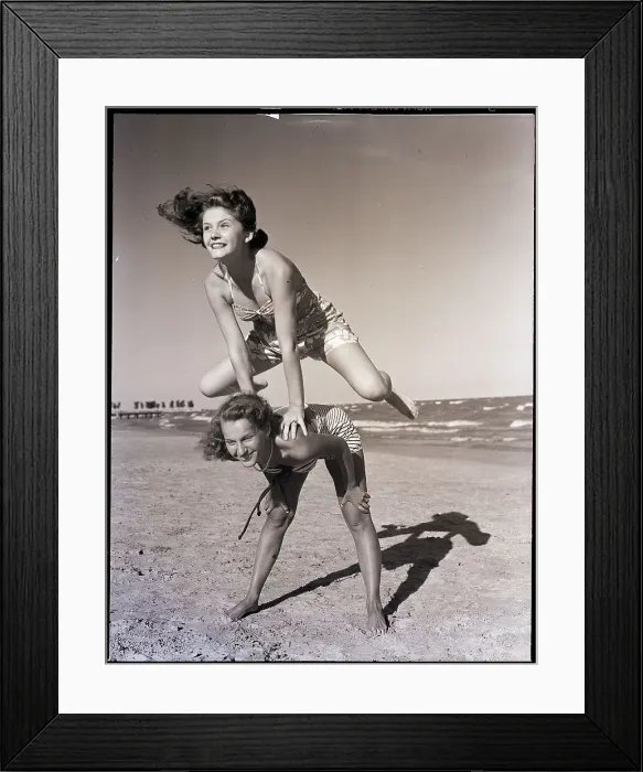 Framed Print : Girls Playing Leapfrog on Beach