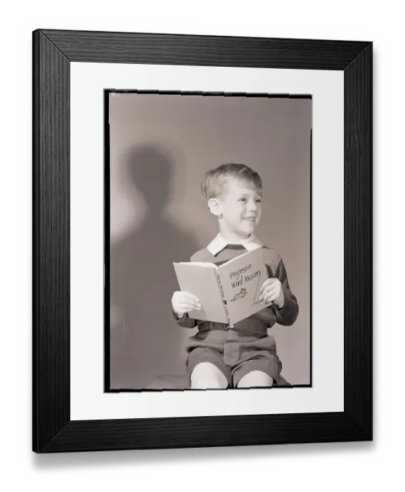 Framed Print : Boy Holding Book Framed Print : Boy Holding Book