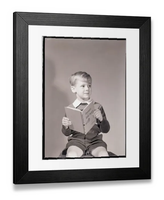 Framed Print : Boy Holding Book Framed Print : Boy Holding Book