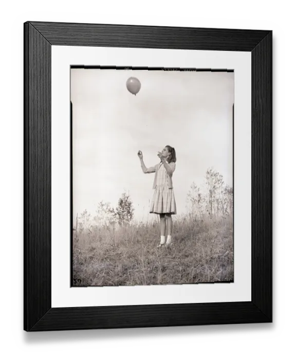 Framed Print : Girl Holding a Balloon Framed Print : Girl Holding a Balloon