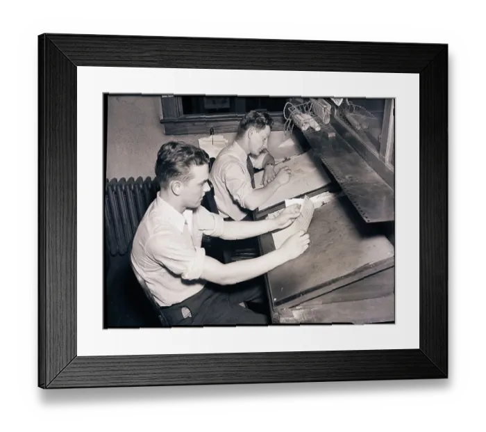 Framed Print : Men At Desks Proofreading Documents