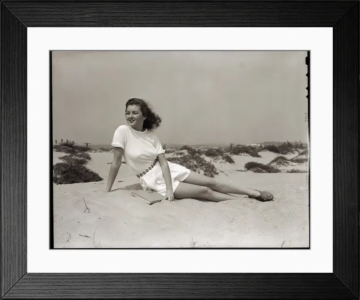 Framed Print : Young Woman Seated on the Beach Framed Print : Young Woman Seated on the Beach