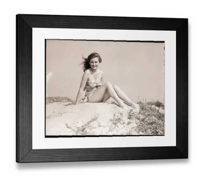 Framed Print : Young Woman Seated on Sand Dune Framed Print : Young Woman Seated on Sand Dune