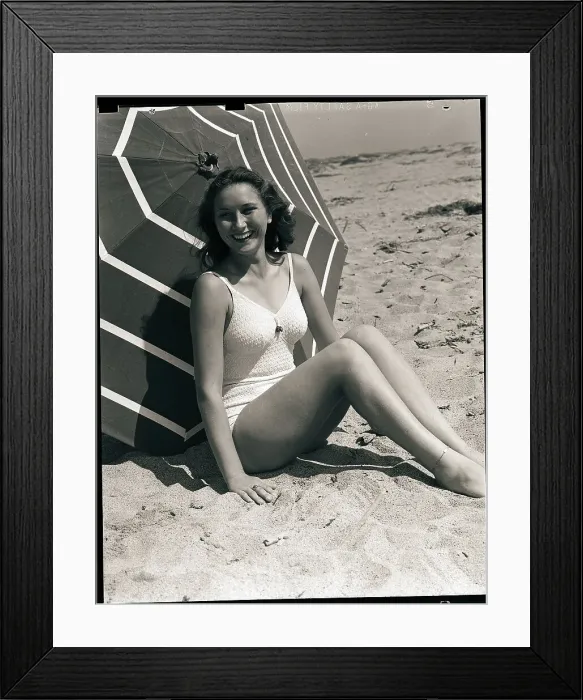 Framed Print : Woman in Swimsuit Seated Framed Print : Woman in Swimsuit Seated