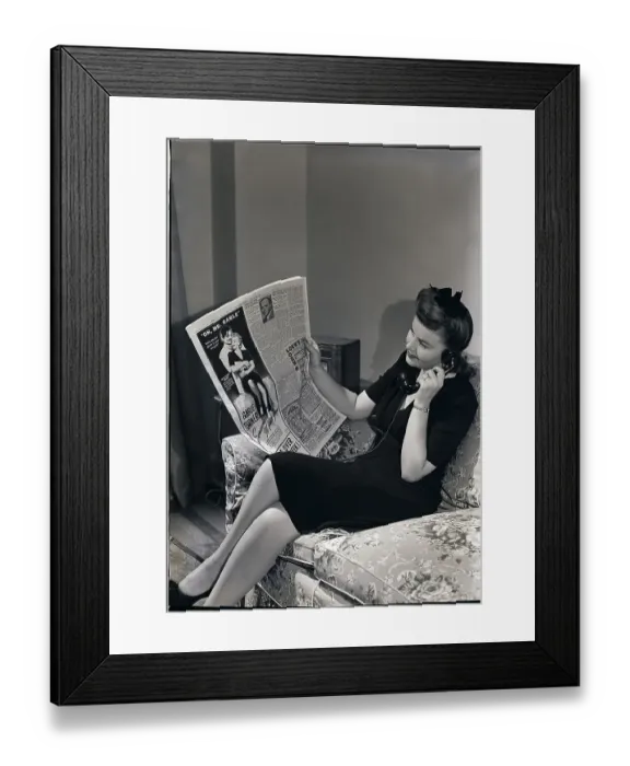 Framed Print : Woman on Phone Reading Newspaper Framed Print : Woman on Phone Reading Newspaper