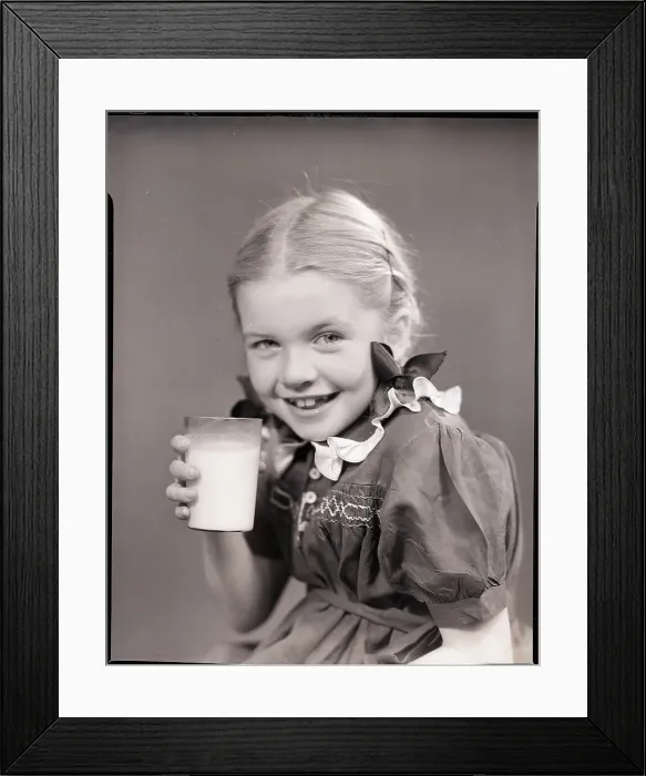 Framed Print : Girl Holding a Glass of Milk Framed Print : Girl Holding a Glass of Milk
