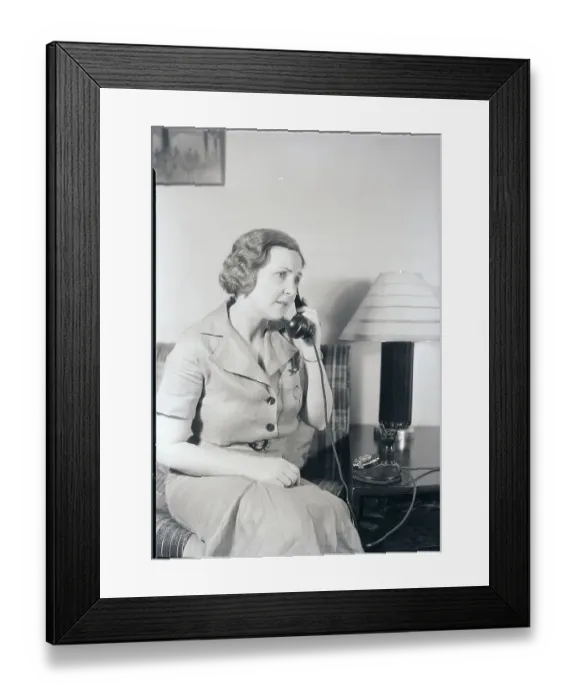 Framed Print : Seated Woman Using Telephone Framed Print : Seated Woman Using Telephone