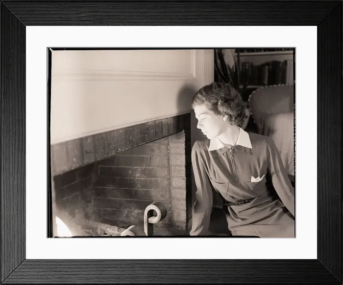 Framed Print : Woman Seated by Fireplace Framed Print : Woman Seated by Fireplace
