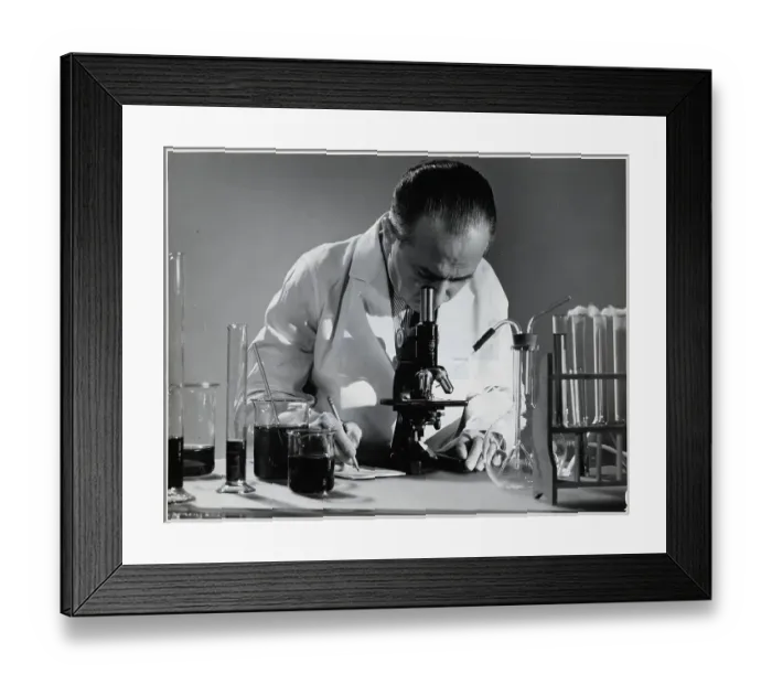 Framed Print : Scientist Peers into Microscope Framed Print : Scientist Peers into Microscope