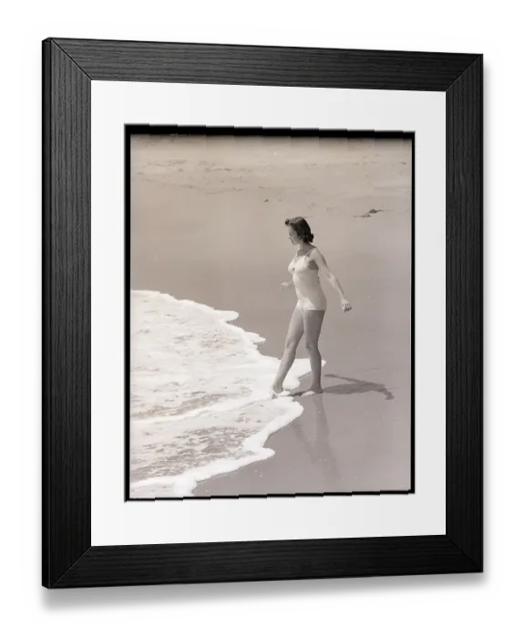 Framed Print : Woman Putting Her Foot in the Ocean Framed Print : Woman Putting Her Foot in the Ocean