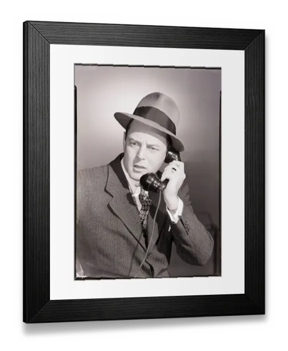 Framed Print : Man in Suit and Hat Using Telephone