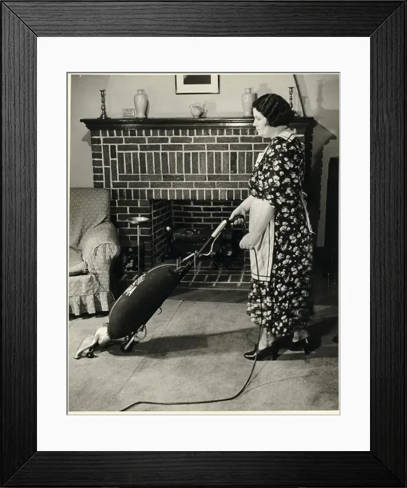 Framed Print : Woman Vacuuming Framed Print : Woman Vacuuming
