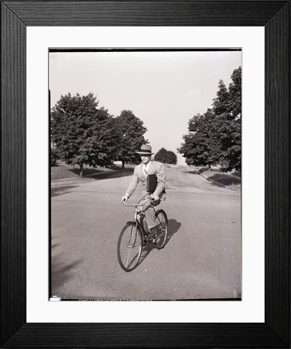 Framed Print : Businessman Riding a Bicycle Framed Print : Businessman Riding a Bicycle